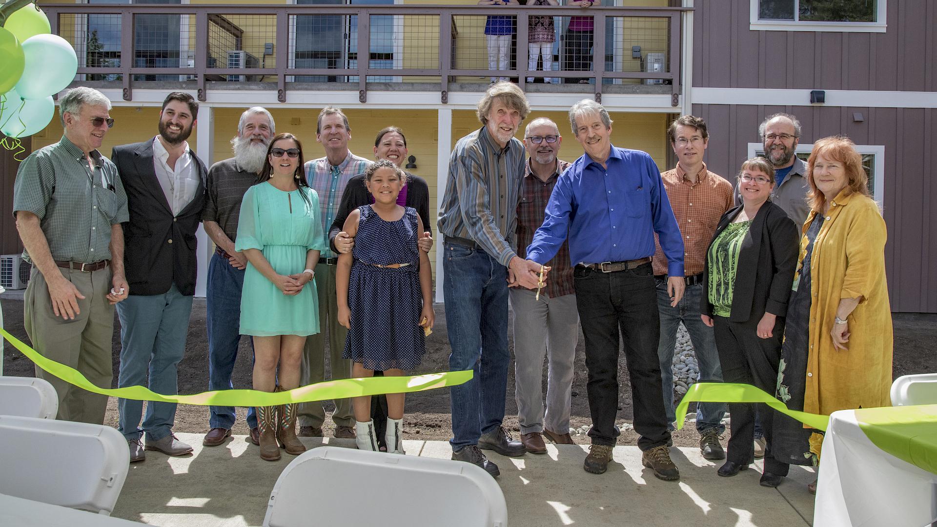 The ribbon cutting with Rural Communities Housing Development and partners. slide image