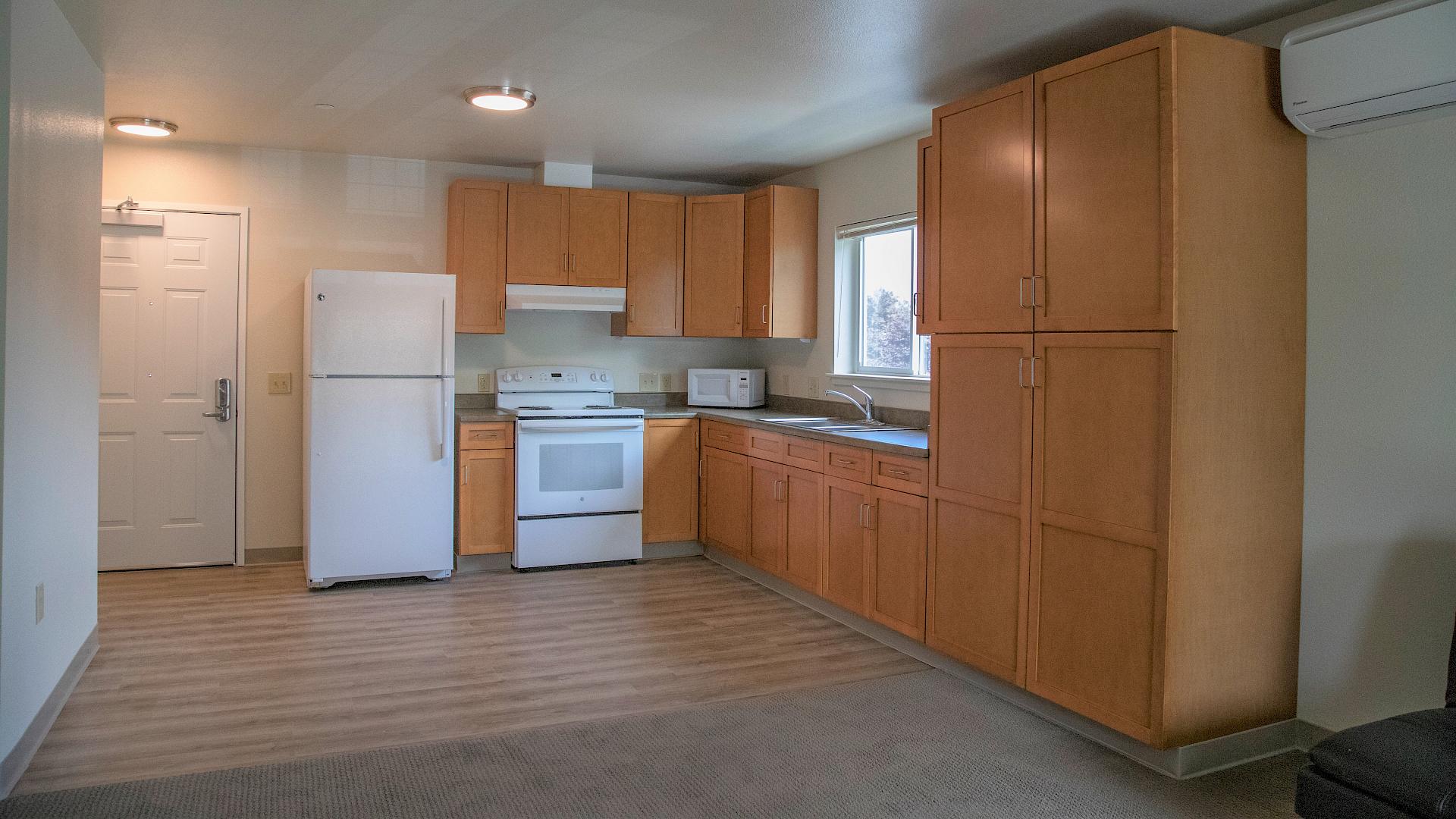One of the kitchens in our 1 bedroom unit. slide image