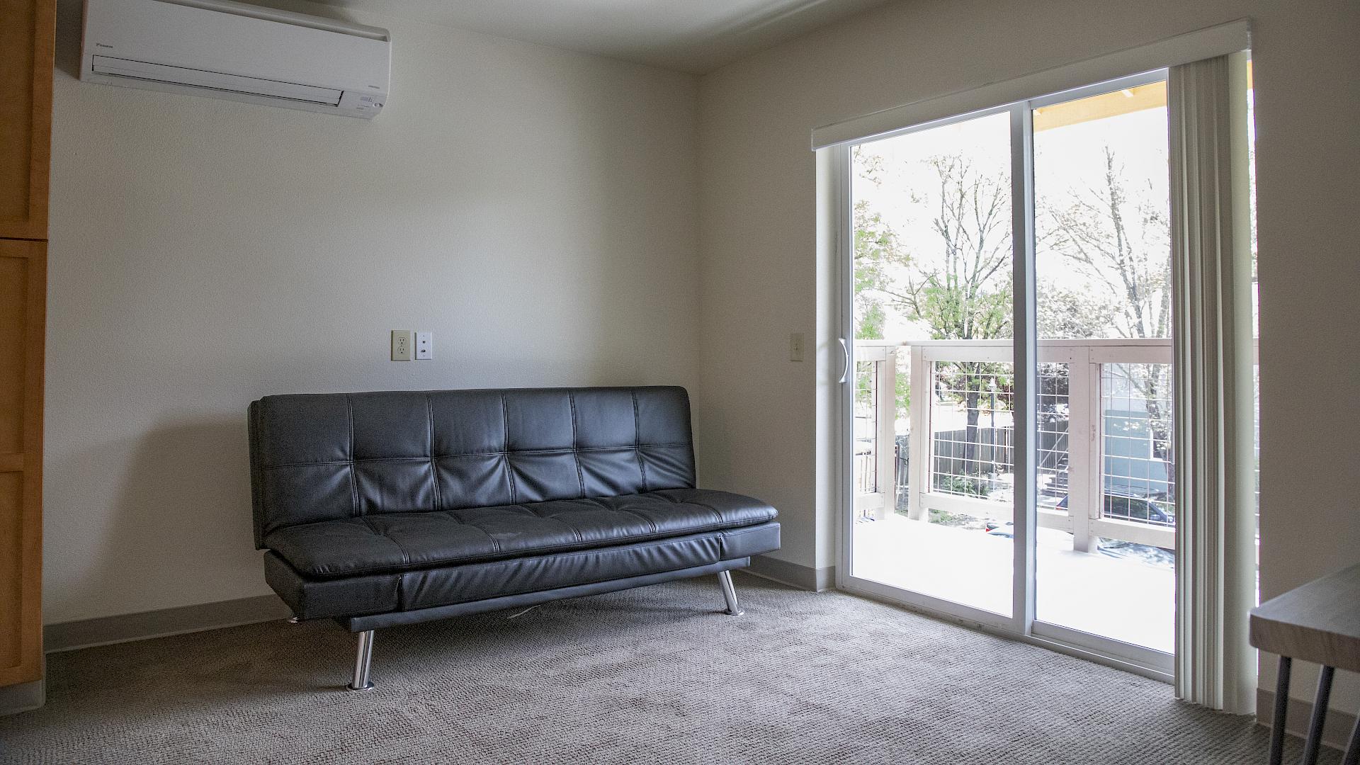 One of the furnished living rooms in our 1 bedroom unit. slide image
